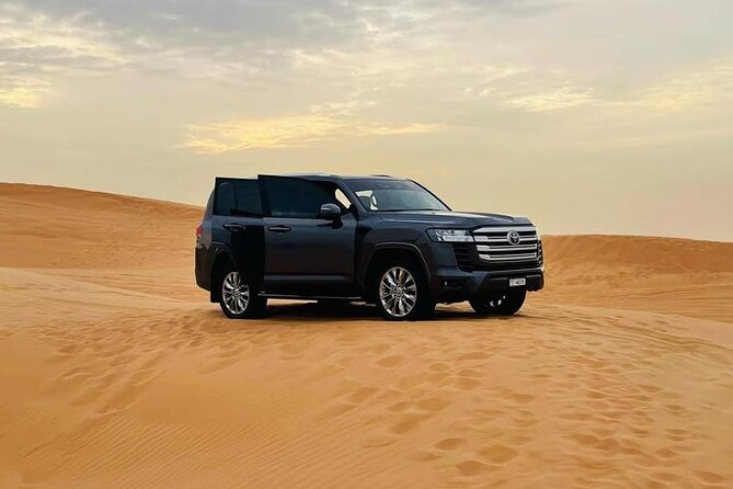 Doha: Desert Safari: Dune Bashing, Quad Bikes & Camel Rides - Camel ride photo stop: short, sweet, and planned with toilet access