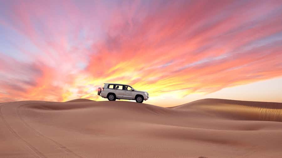 Doha: Desert Safari, Sandboarding, Dune Bashing & Inland Sea - Mesaieed Camp Stop: Quick Camel Time and Short Activities