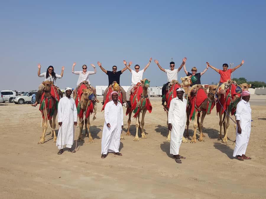 Doha: Desert Safari with Camel Ride Family Friendly Tour - Inland Sea Stop Near the Saudi Border: Swimming and Sunset Views