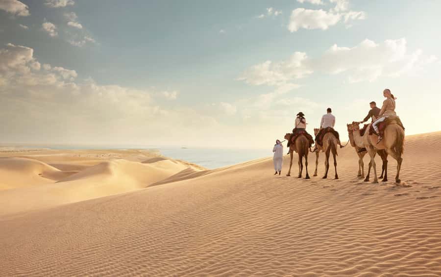 Doha: Desert Safari with Dune Bashing and Inland Sea - Mesaieed stops: photos, quick breaks, and the camel ride question