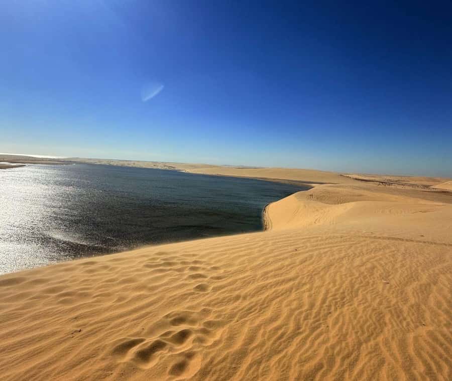 Doha: Guided Desert Safari Tour with Pickup & Drop Service - Mesaieed: desert scenes, sunset timing, and the second round of action