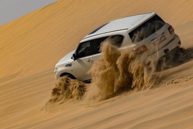 Doha Half Day Desert Safari Dune Bashing Camel Ride Sandboarding - Off-Road Dune Bashing in a 4x4: Picture Dune First, Then the Adrenaline