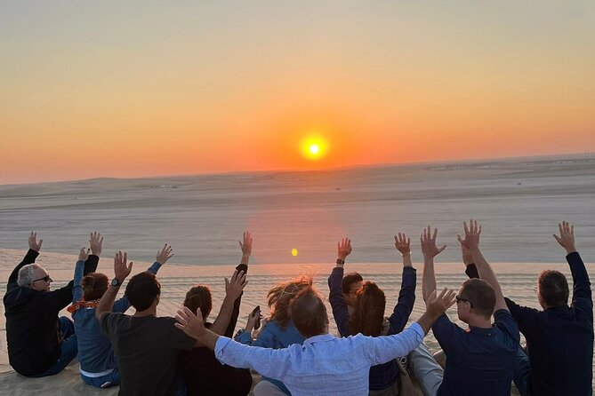 Doha Half Day Desert Safari Dune Bashing Camel Ride Sandboarding - Sunset Stop in the Dunes on the Way Back to Doha