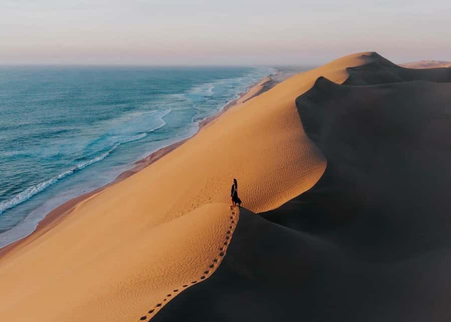 Doha: Inland Sea Desert Safari with Sunset & Sunrise Views - Inland Sea Desert Safari: The Sea Meets the Dunes Moment
