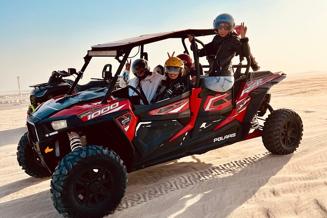 Doha: Luxury Desert Safari, Quad Bike & Sandboarding - Inland Sea stop: blue water, golden dunes, and Saudi mountains in the distance