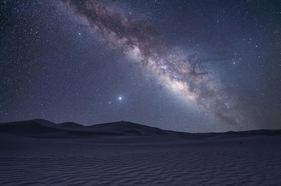 Doha: Night Safari with Dune Bashing and Camel Ride - Inland Sea Beach photo stop: a scenic break on the return