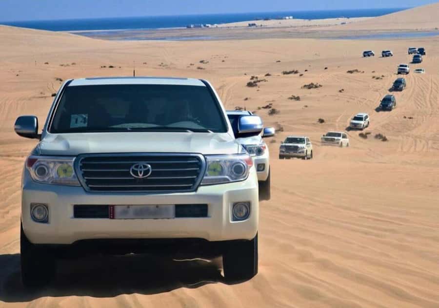 Doha: Overnight Desert Camping With BBQ Dinner & Breakfast - Getting out of Doha: pickup, AC ride, and your first quick tastes