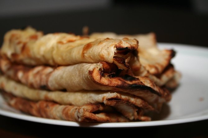 Doha: Pearl Island Food Tour - 7 Tastings, AC Vehicle - Stop 4: Porto Arabia and the karak tea plus cheese chapati combo