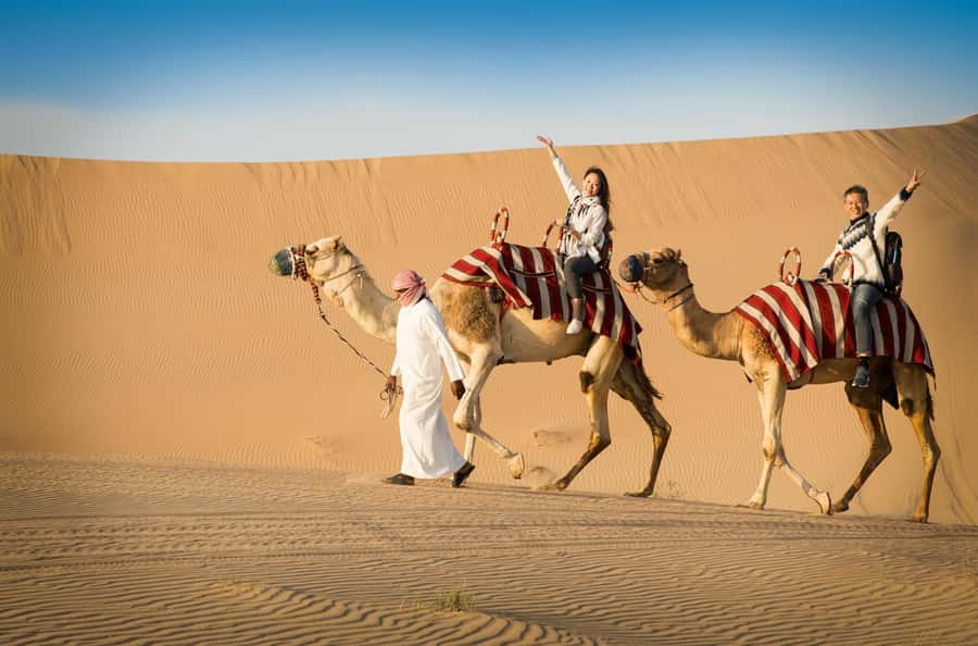 Doha: Safari, ATV, Camels, Sandboarding and Inland Sea Tour - Sealine Beach Photo Stop and Camel Ride Moment