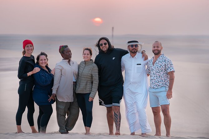 Doha Sharing Desert Safari with Dune Bashing and Sand Boarding - Sealine Beach: falcon photos, camel ride options, and traditional tea
