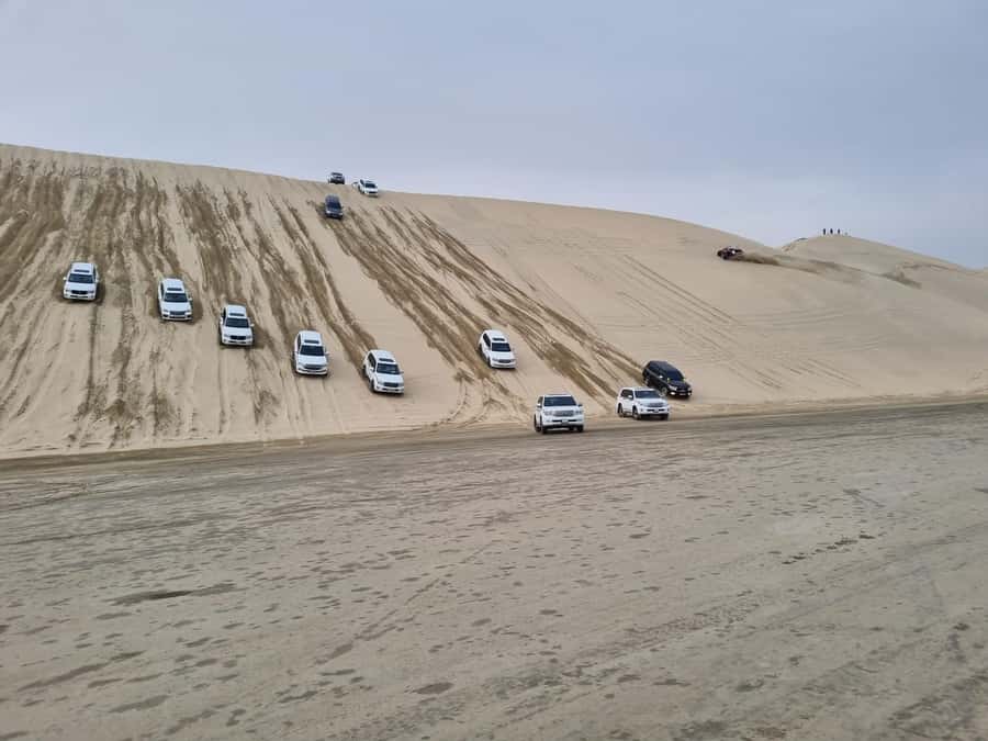 Doha: Sunset desert tour with Camel Ride, Inland Sea & Tea - Why Khor Al Adeid sunsets feel different from typical desert tours