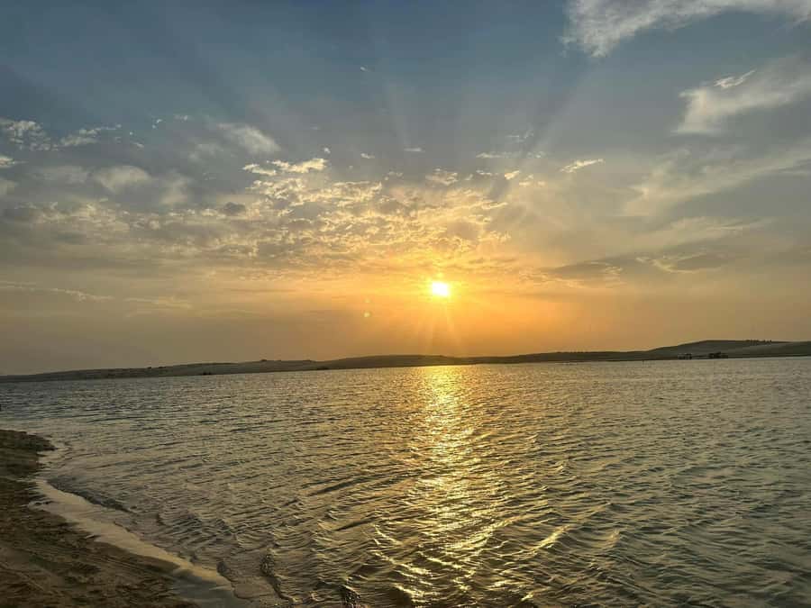 Doha: Sunset desert tour with Camel Ride, Inland Sea & Tea - Mesaieed camel ride: quick, scenic, and worth doing