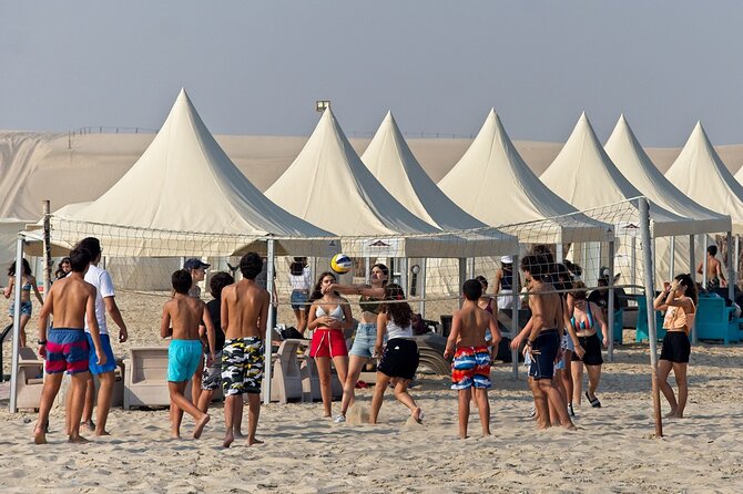 Private Full Day Desert Safari - Desert camp time: camel rides, sandboarding, and beachside comfort