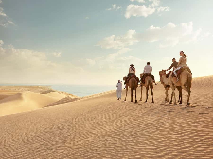 Qatar Desert Safari, Quad bike, Camel Ride and Sandboarding - Sandboarding Session: A Snowboarding-Style Thrill on Sand