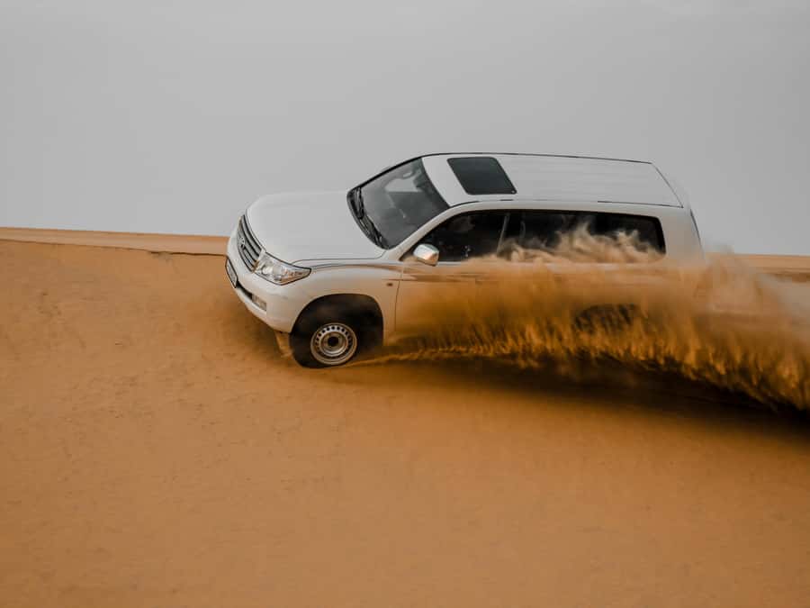 Qatar Desert Safari, Quad bike, Camel Ride and Sandboarding - The Big Pulls: Dune Bashing, Sandboarding, Camels, and Optional Quad Bikes