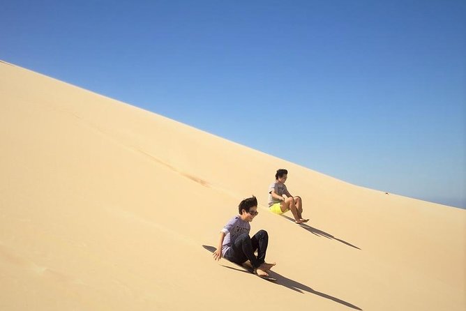 Qatar Gold Dune Safari, Dune Bashing,Camel Ride,Sand Boarding,Inland Sea Desert - Sandboarding on Qatar’s golden dunes: what to wear and expect