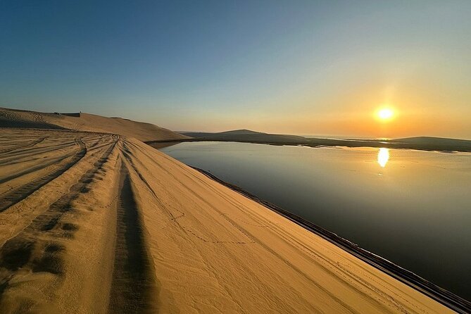 Qatar: Sunrise or Sunset Desert Tour in Doha, unforgettable trip - Sealine Beach stop: camels, a first look at the dunes, and optional quad bikes