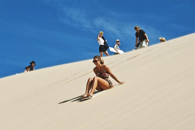 Sharing or Private Safari, Sand Boarding, Camel Ride, inland Sea Quick swim - Khor Al Adeid Inland Sea Stop: Rocky Terrain, Panoramic Dunes, Border Views